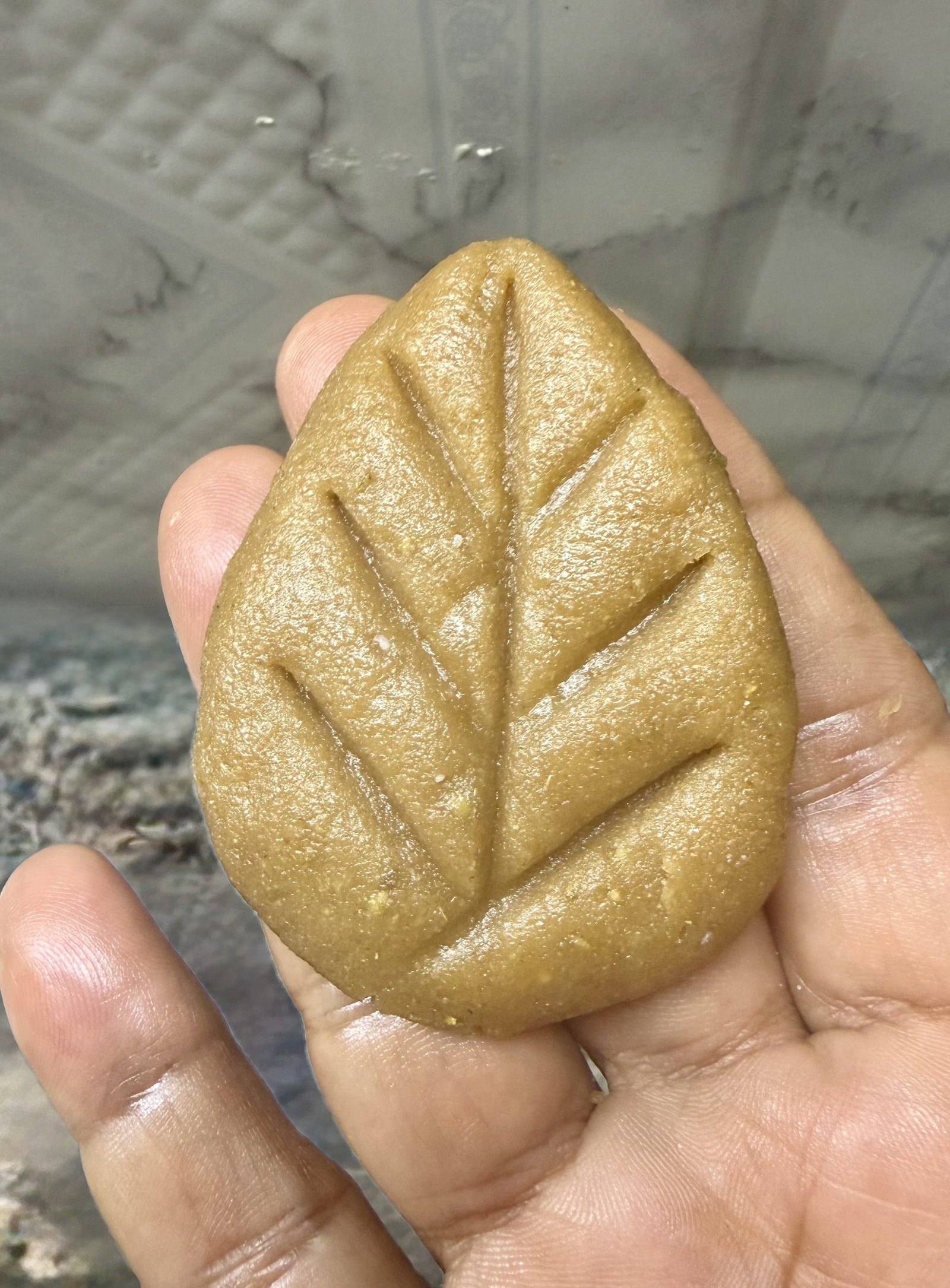 Step 4.2: Pinch one end to shape into a leaf, and press a fork or toothpick lightly onto the surface to create decorative patterns
