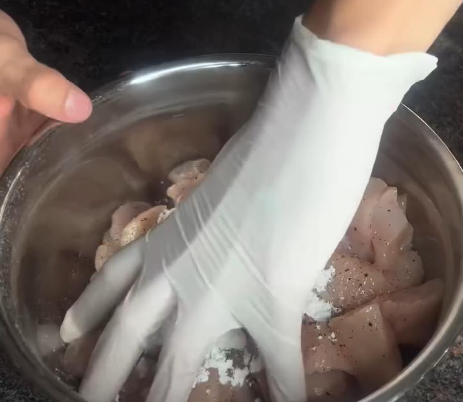 Step 1.1: Dice the chicken breast, season with salt and pepper, and coat in corn flour