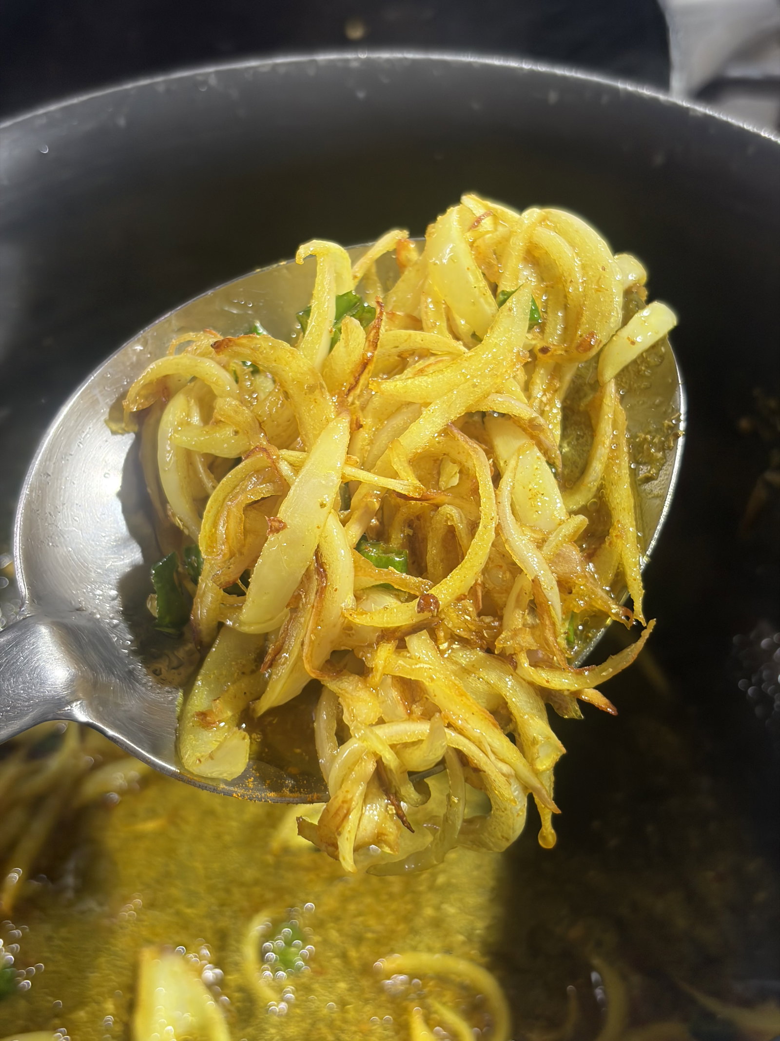 Step 1.1: Lower the heat slightly and add the salt, turmeric powder, and coriander powder