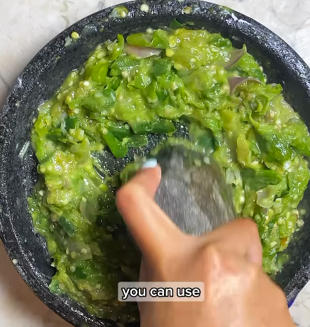 Step 1.1: Transfer the sautéed ingredients to a mortar and pestle or chopper and grind into a coarse paste