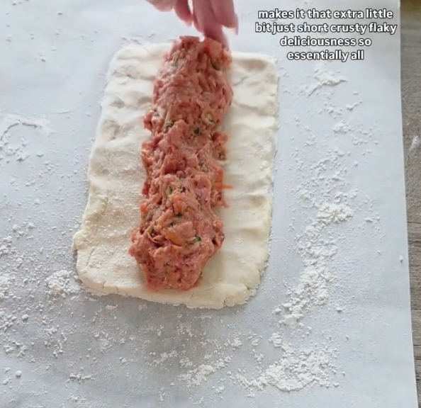 Step 2.1: Roll out the pastry and add the meat filling in a sausage shape along the edge