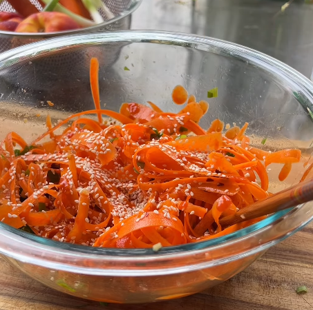 Step 1.1: Top with finely chopped green onions and sesame seeds before serving