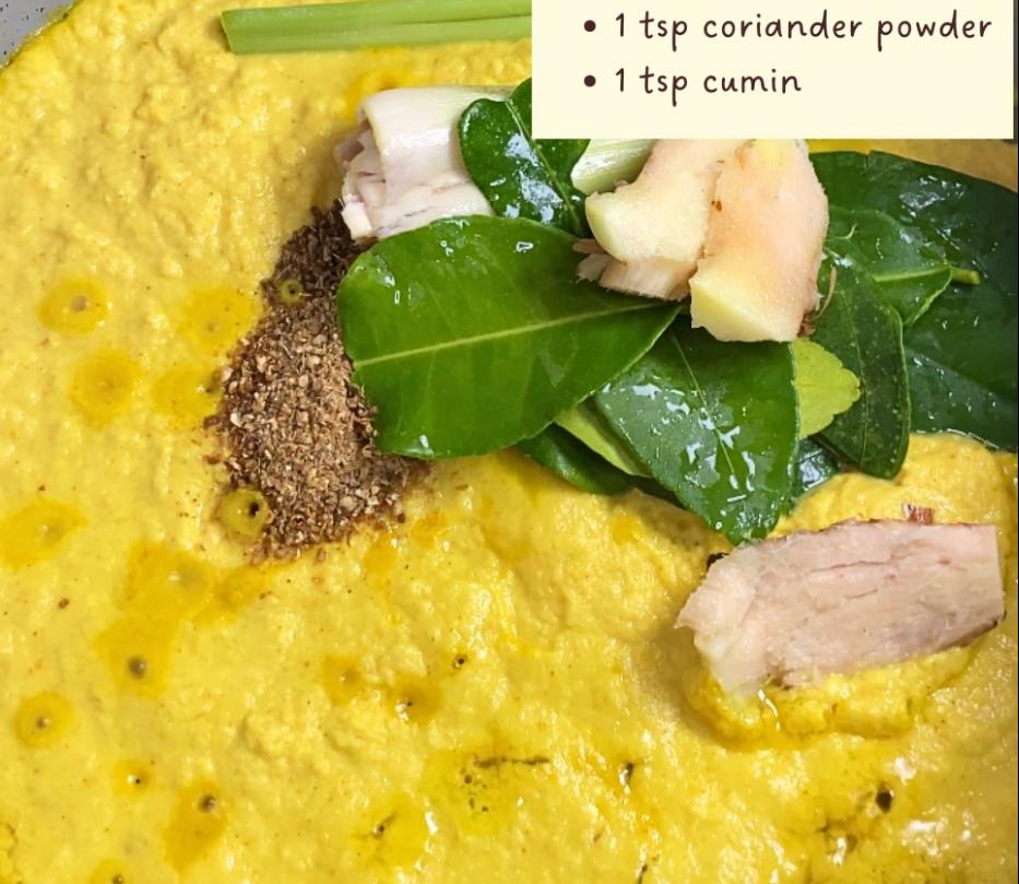 Step 3.1: Saute the spice paste with galangal, lemongrass, lime leaves, bay leaves, coriander powder, and cumin until fragrant