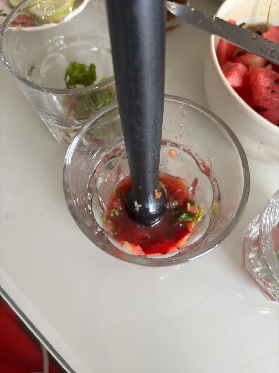 Step 2.1: Muddle gently until the fruit releases its juices and the mint is fragrant
