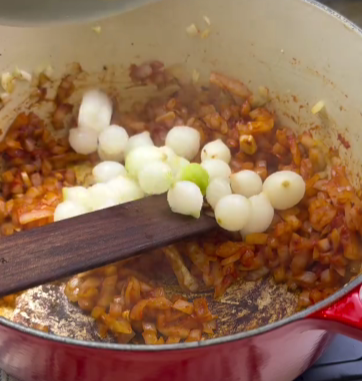 Step 1.1: Add the carrots, pearl onions, and mushrooms to the pot