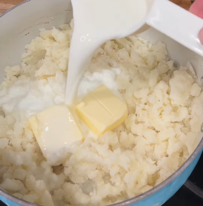 Step 2.1: Drain the potatoes, then mash them