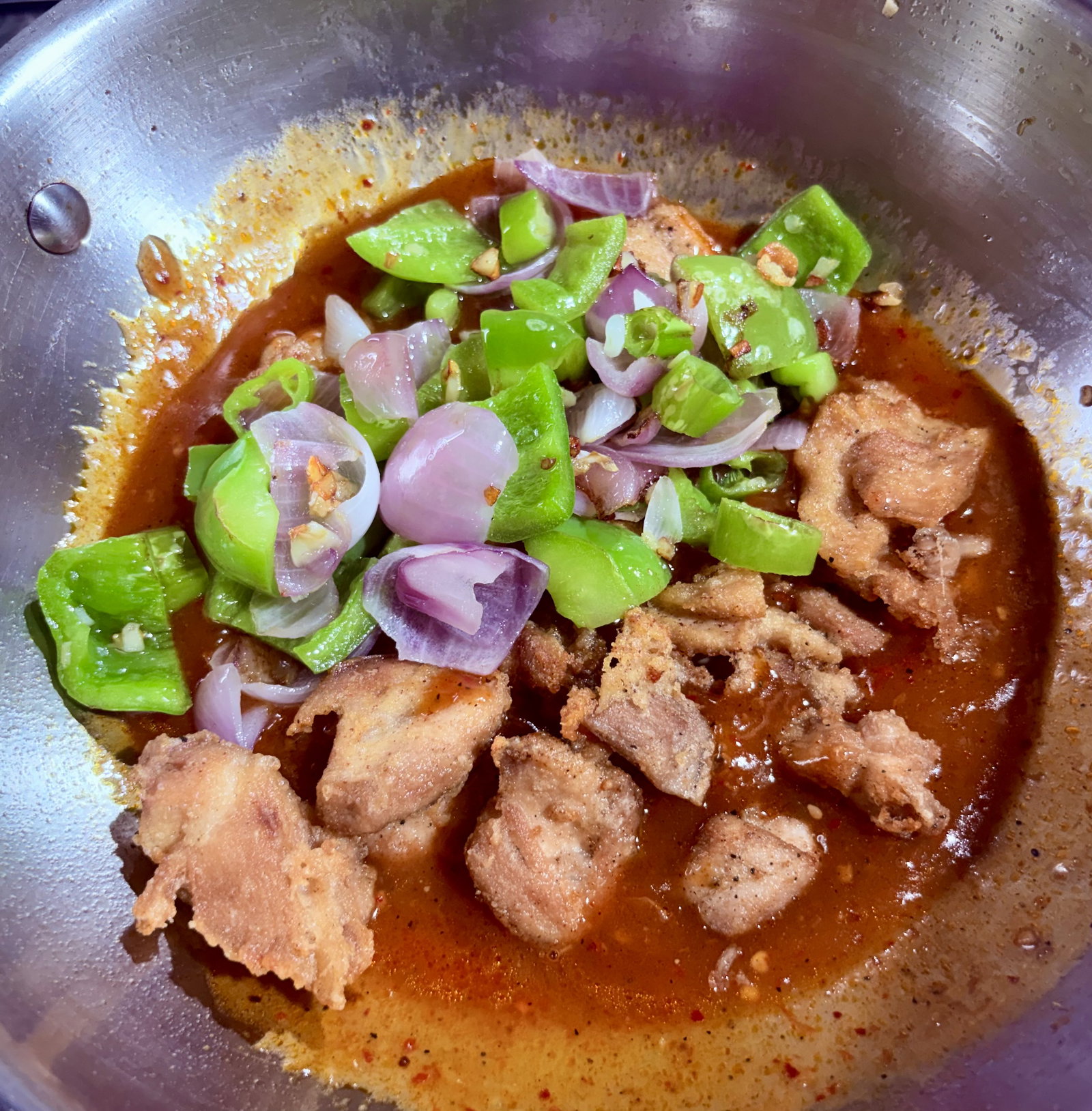 Step 3.1: Add the fried chicken and sautéed vegetables back into the wok