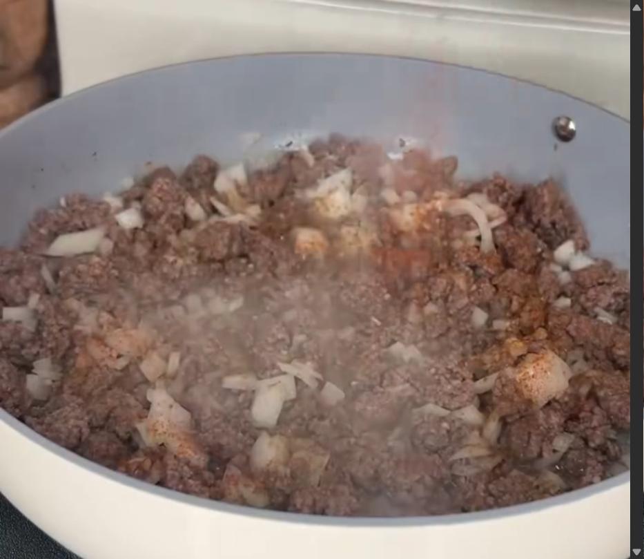 Step 1.1: Mix in diced onions, garlic, and seasonings, and cook until onions are softened