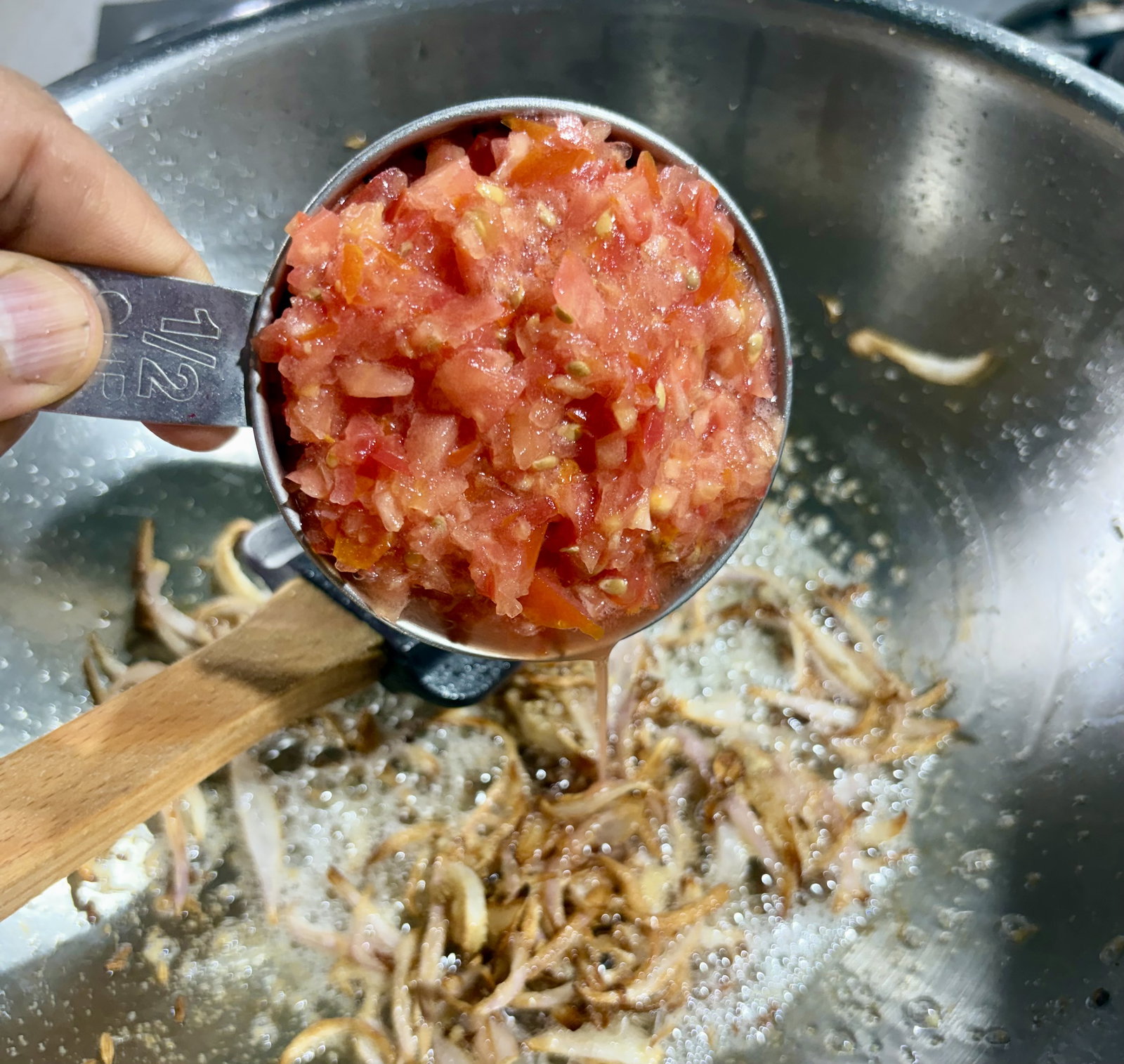 Step 2.1: Add the chopped tomatoes and green chillies