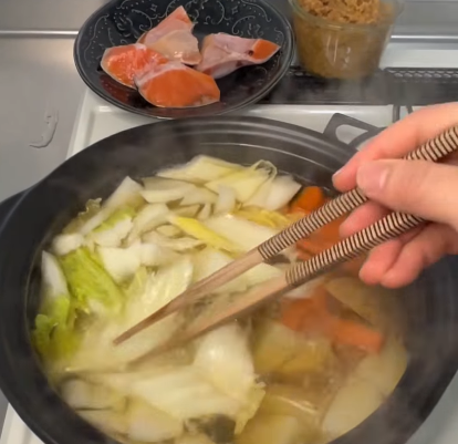 Step 1.1: Start by boiling the potatoes and carrots in dashi stock until tender
