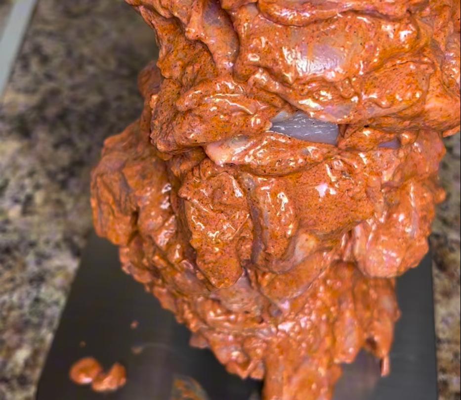 Step 1.1: Stack the marinated chicken onto a kebab spike and wrap it in greaseproof paper, then in foil