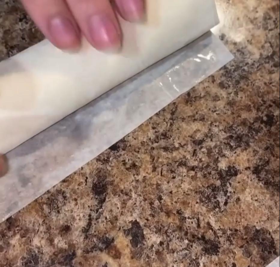 Step 3.1: Spoon the cream onto the filo and roll the pastries into cigars, sealing the edges with water