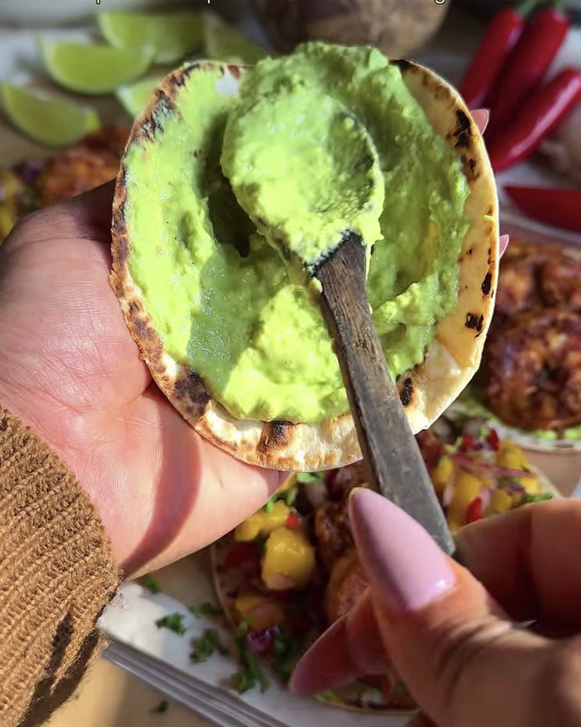 Step 5.1: Spread a thick layer of avocado crema on the tortilla