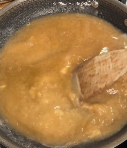 Step 3.1: Pour in the beef broth and bring to a light boil while stirring