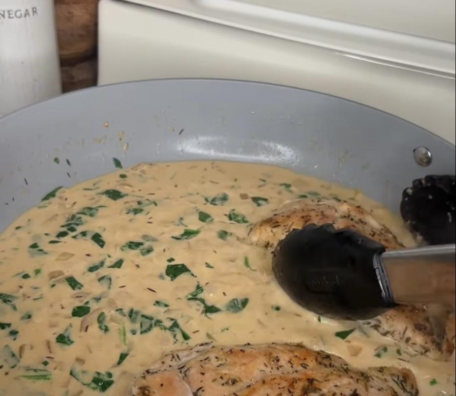 Step 2.1: Add chopped spinach to the sauce and stir until wilted