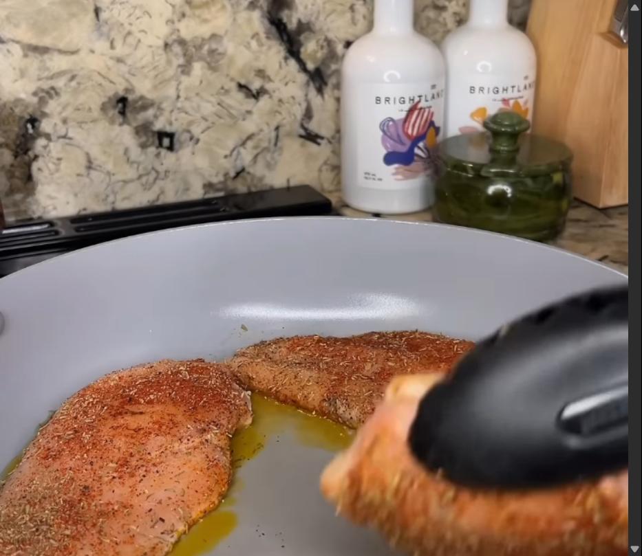 Step 1.1: Heat olive oil in a large pan and cook chicken on both sides until browned