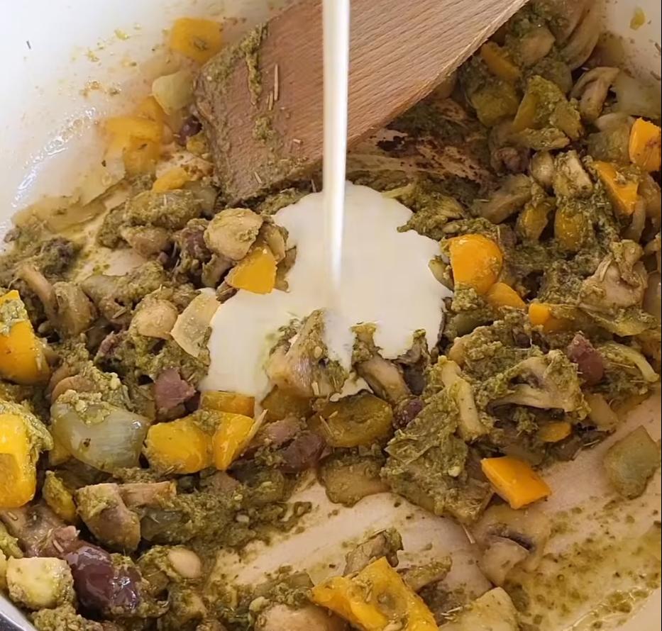 Step 1.1: Stir in green pesto, double cream, and pasta water, mixing well