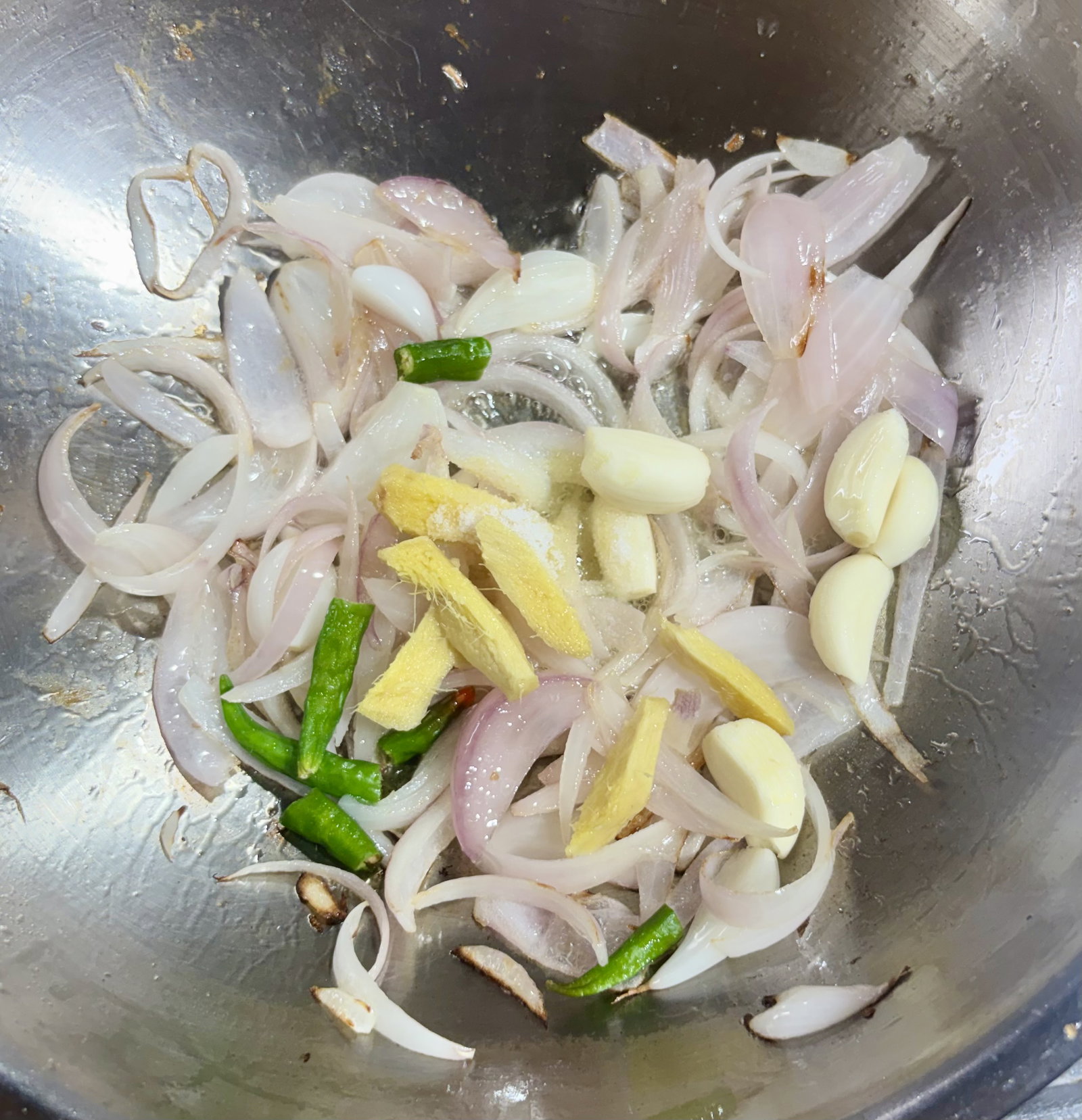 Step 2.1: Add the ginger, garlic, green chillies, and salt
