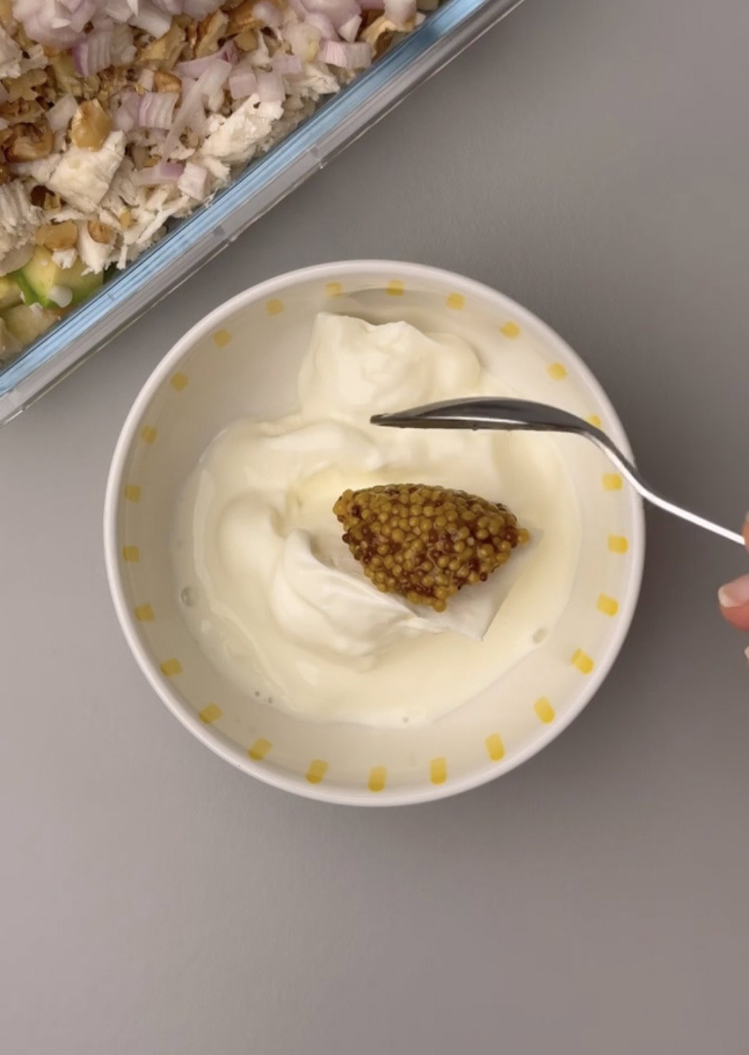 Step 1.1: Pour Greek yogurt, Dijon mustard, minced garlic, lemon juice, soy sauce, salt, and black pepper over the salad ingredients