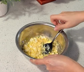Step 1.1: Mix crumbled Feta cheese, egg, chopped scallions, paprika, and crushed red pepper flakes in a large bowl until well combined