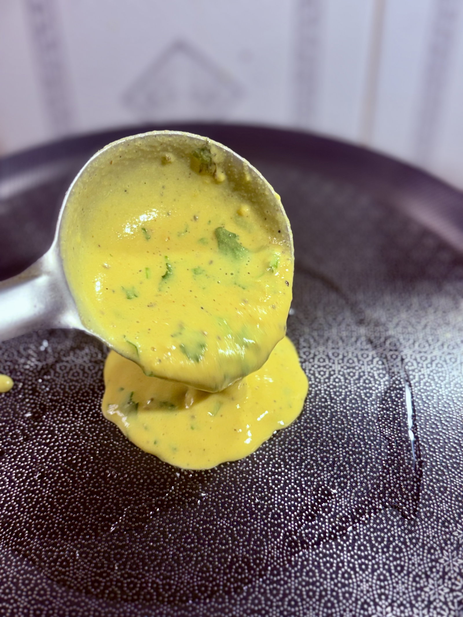 Step 1.1: Lower the heat and pour a ladleful of batter into the centre