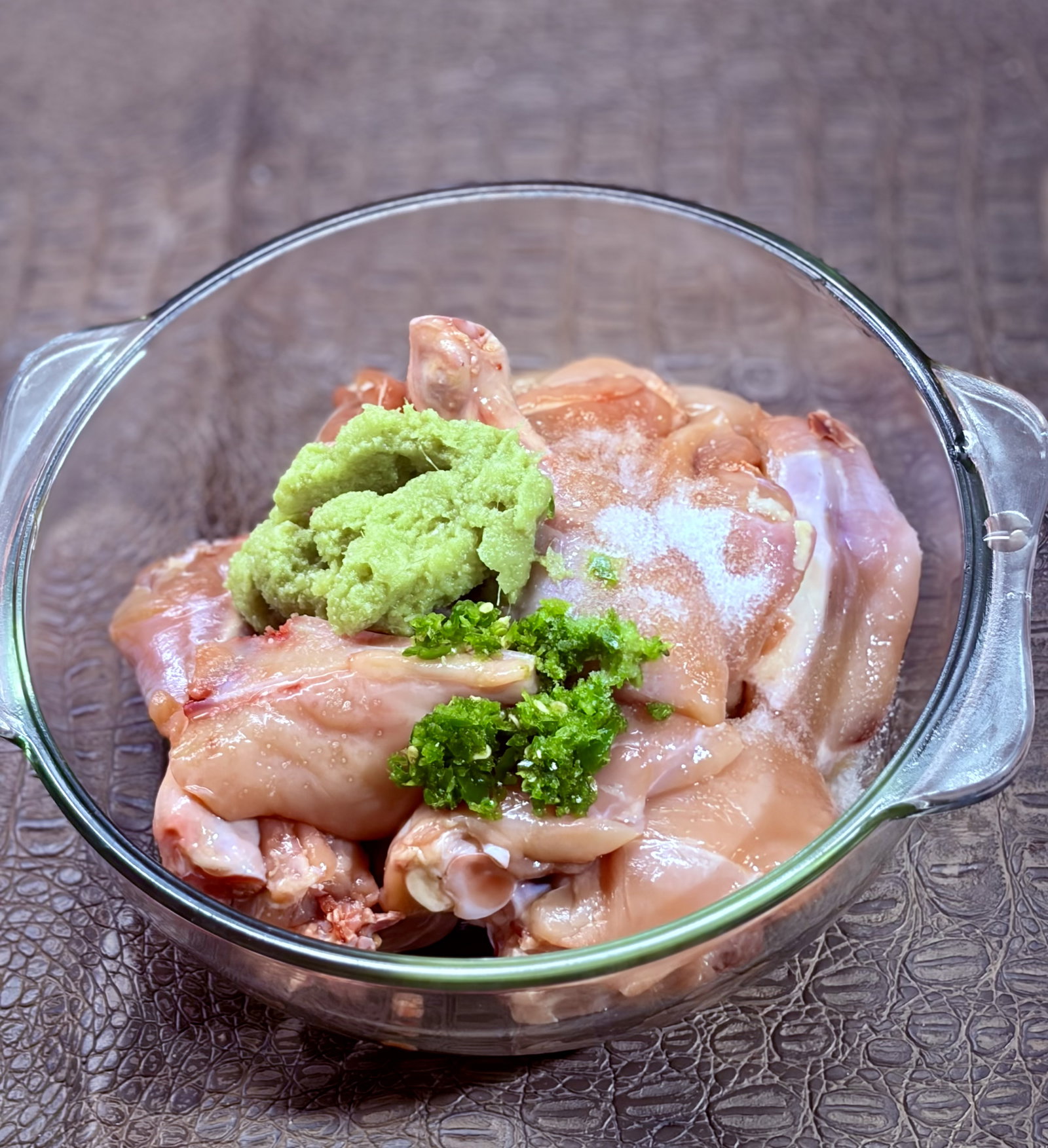 Step 1.1: In a large bowl, add the chicken pieces along with ginger-garlic paste, green chilli paste, and 1 teaspoon of salt