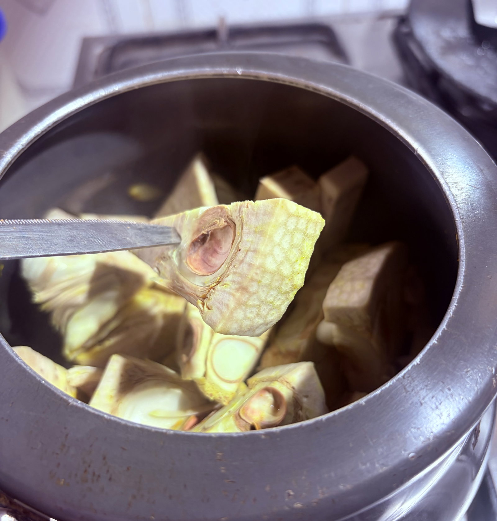 Step 1.1: Drain the jackfruit and reserve the turmeric water for later use