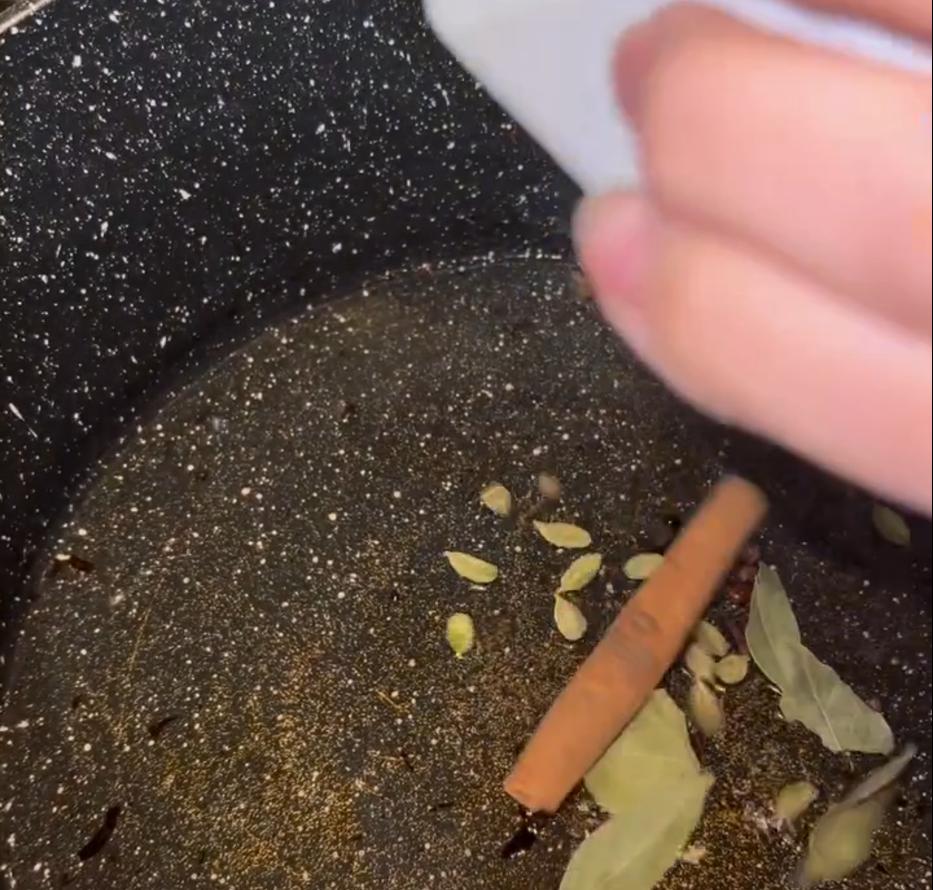 Step 1.1: Heat oil in the same pot and add cinnamon stick, bay leaves, cardamom pods, and cloves