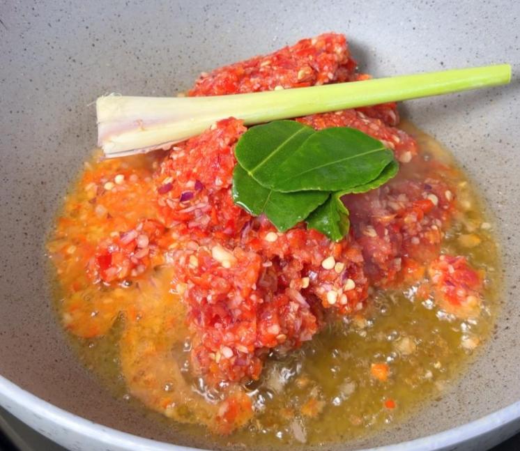 Step 1.1: Saute the spice paste with lemongrass and lime leaves until fragrant