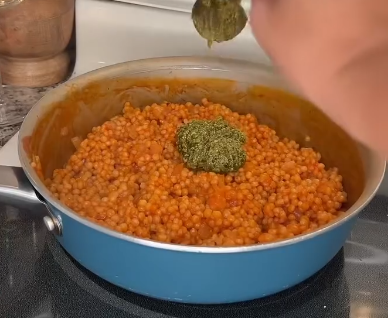Step 2.1: Uncover and stir in basil pesto