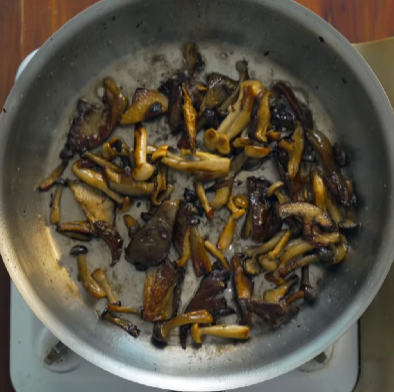 Step 2.1: Heat olive oil in a pan and sauté the mushrooms over high heat until nicely caramelised