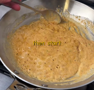 Step 2.1: Fry 3/4 of the prepared paste in the coconut cream until the oil separates