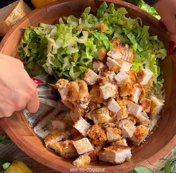 Step 2.1: Add crushed croutons, finely shredded romaine lettuce, and crispy chicken chunks