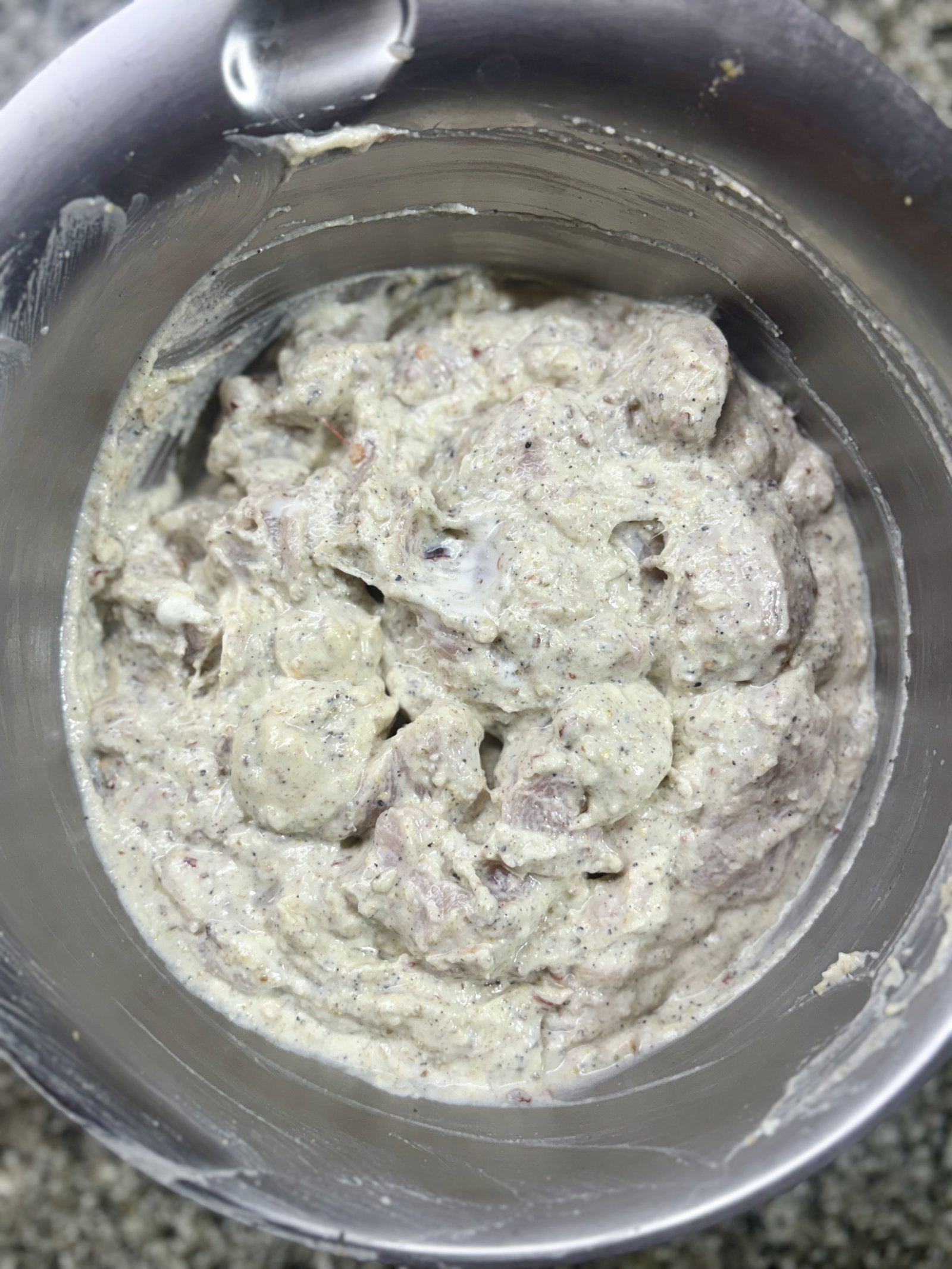 Step 1.1: Add the chicken pieces and toss until thoroughly coated
