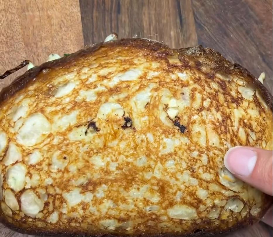 Step 1.1: Melt the butter in a pan over low-medium heat and cook the sandwich, pressing down with something heavy like a saucepan, until golden on both sides and the cheese has melted