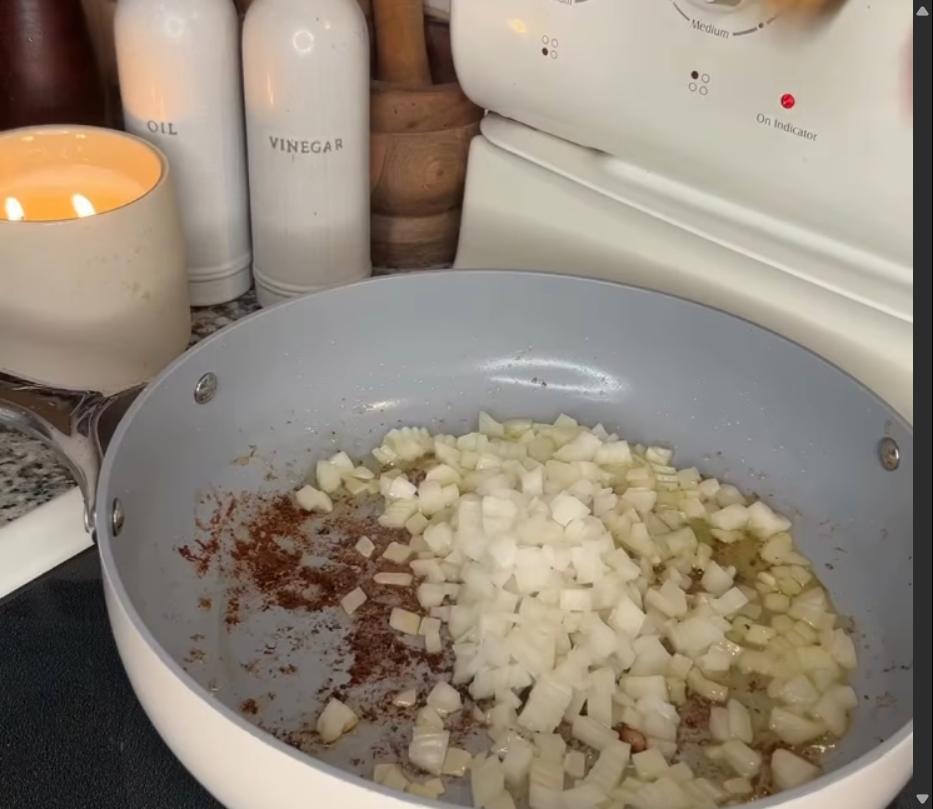 Step 2.1: Sauté diced onions and minced garlic in the same pan until softened and fragrant
