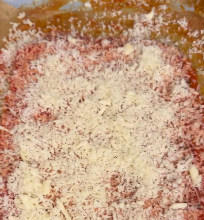 Step 1.1: Remove from the oven and spread marinara sauce on top