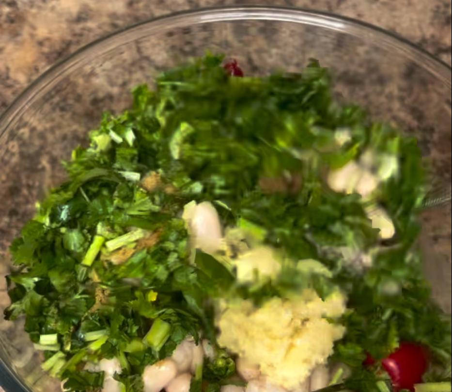 Step 1.1: Mix the white beans with the garlic, cumin, fresh coriander, and chillies, then add them to the pot