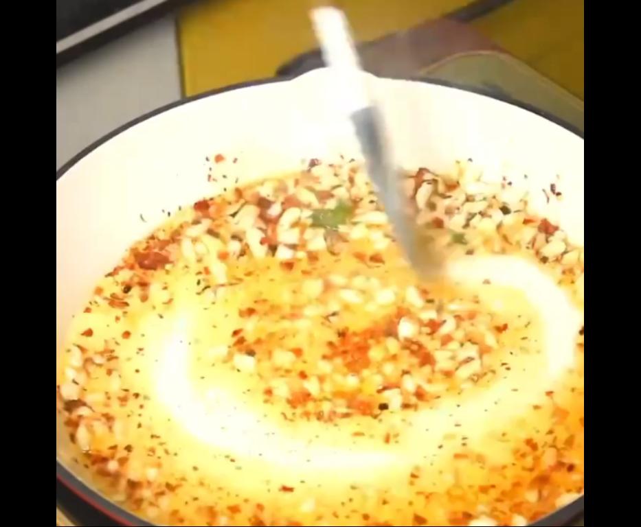 Step 1.1: Add chilli flakes after a minute