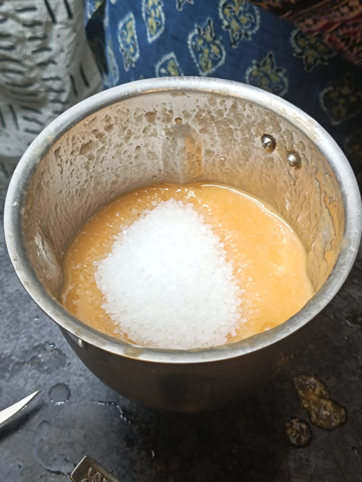 Step 1.1: Add chilled water and sugar to the sieved juice and mix well until the sugar dissolves