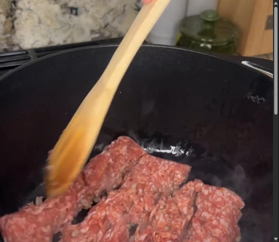 Step 1.1: Heat olive oil in a large pot or Dutch oven and sauté Italian sausage, breaking apart, until browned