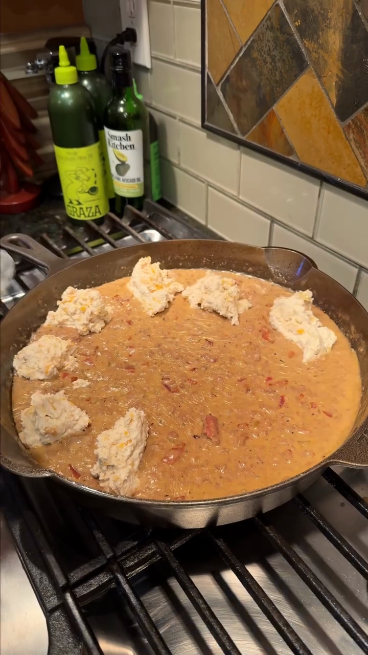 Step 3.1: Drop spoonfuls of biscuit dough evenly across the beef mixture, leaving some gaps between biscuits so they can expand and brown