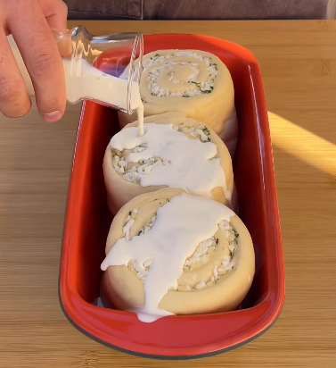 Step 2.1: Pour the cream mix over the rolls right before baking