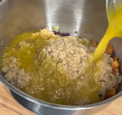 Step 5.1: Pour the vinaigrette over the quinoa salad and stir to combine evenly