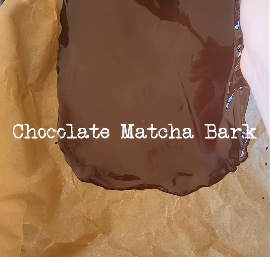 Step 1.1: Pour dark chocolate onto a lined baking tray and spread into a rectangle using the back of a tablespoon