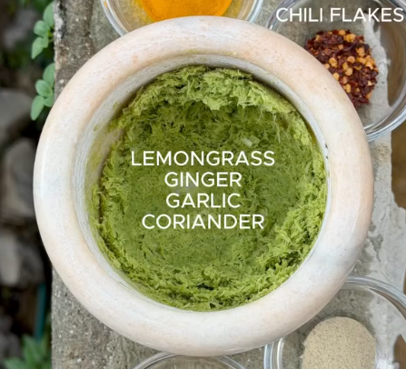 Step 1.1: Pound lemongrass stems, fresh ginger, garlic, fresh coriander, coriander seeds, turmeric, white pepper, chili flakes, and lime zest together until a smooth paste forms