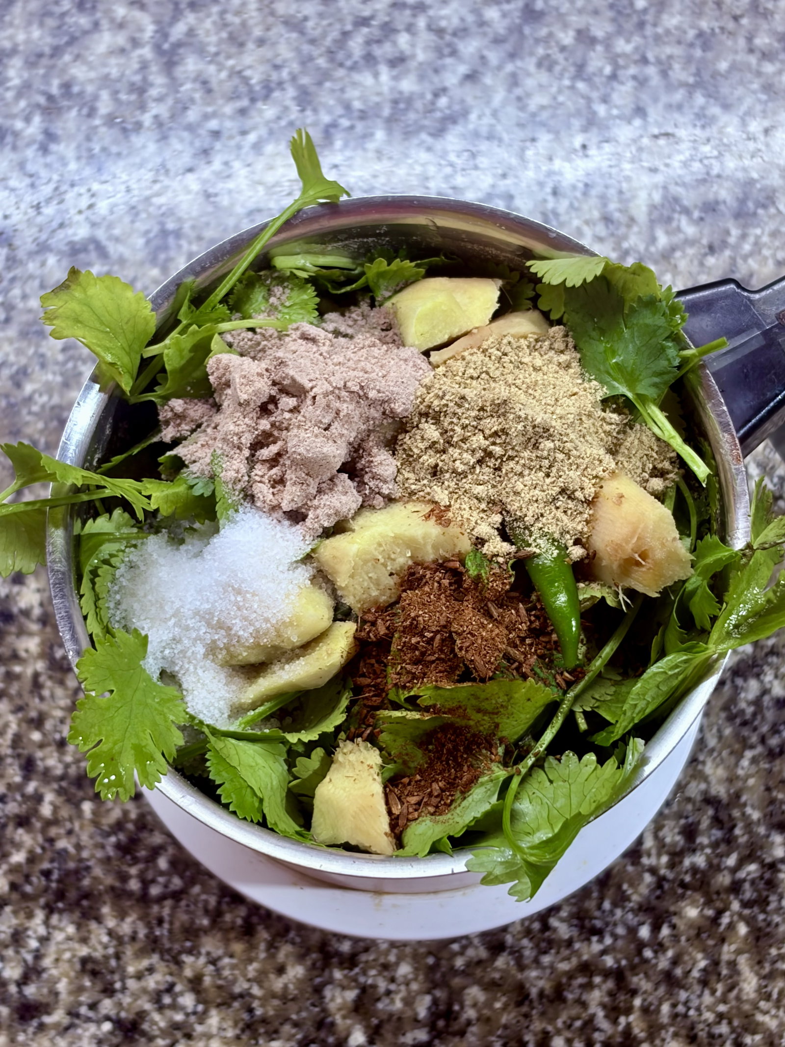 Step 1.1: Add the cleaned herbs, ginger, green chillies, and all the dry spices (black salt, roasted cumin, salt, and chaat masala) into a blender