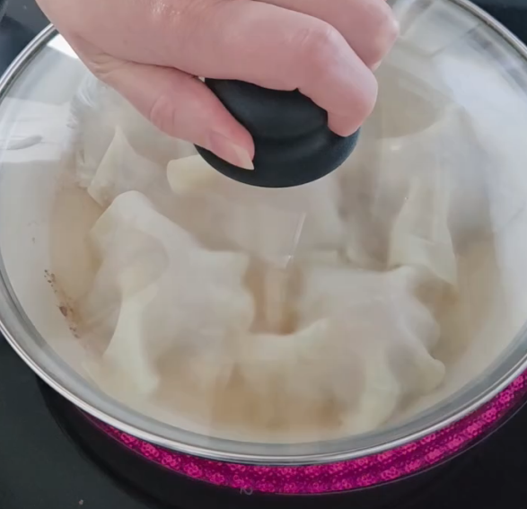 Step 1.1: Add about 1/3 cup water to the pan and cover with a lid