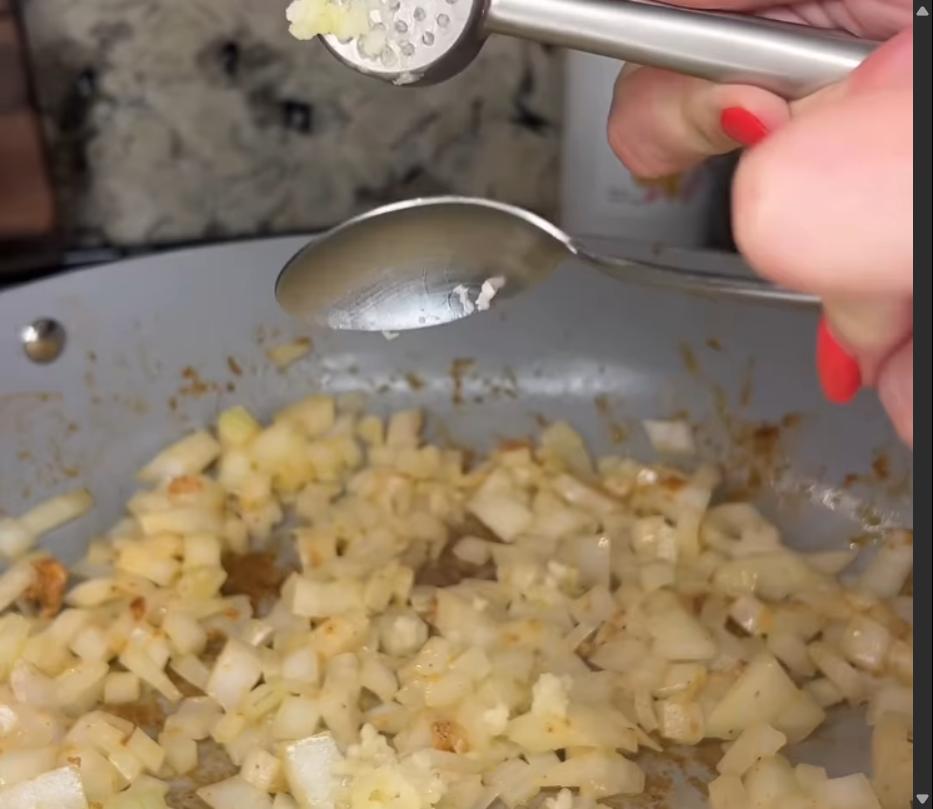 Step 2.1: Add minced garlic and ginger paste, stirring until fragrant, about 1 minute