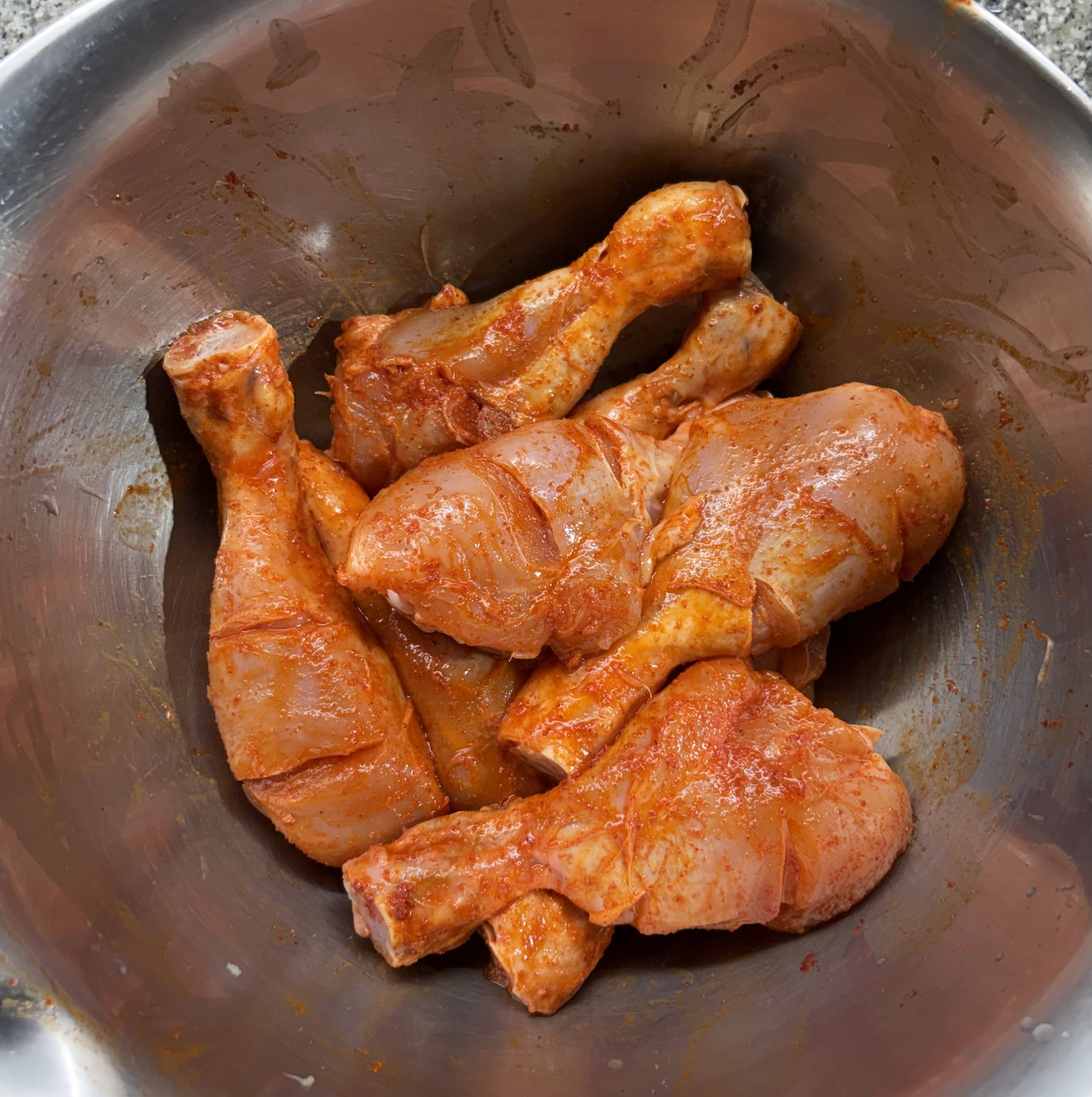 Step 1.1: In a large bowl, combine the drumsticks with lemon juice, Kashmiri red chilli powder, and salt
